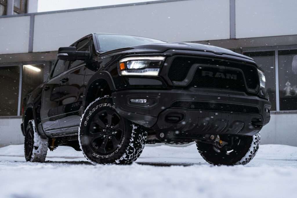 a black truck parked in front of a building