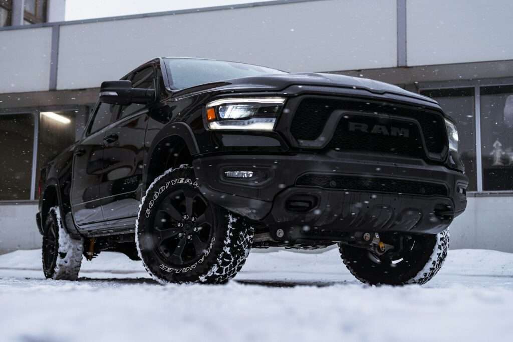 a black truck parked in front of a building